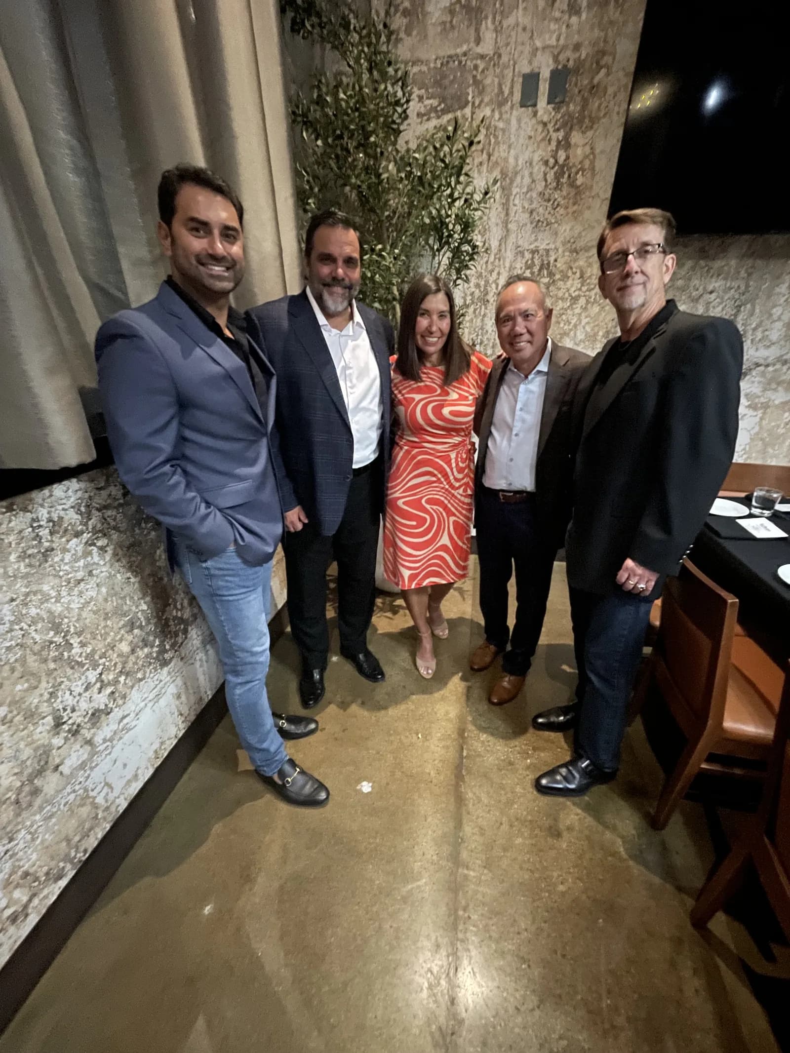 Dr. Michael Njo with dentists and referral partners at the Panel of Experts dinner.