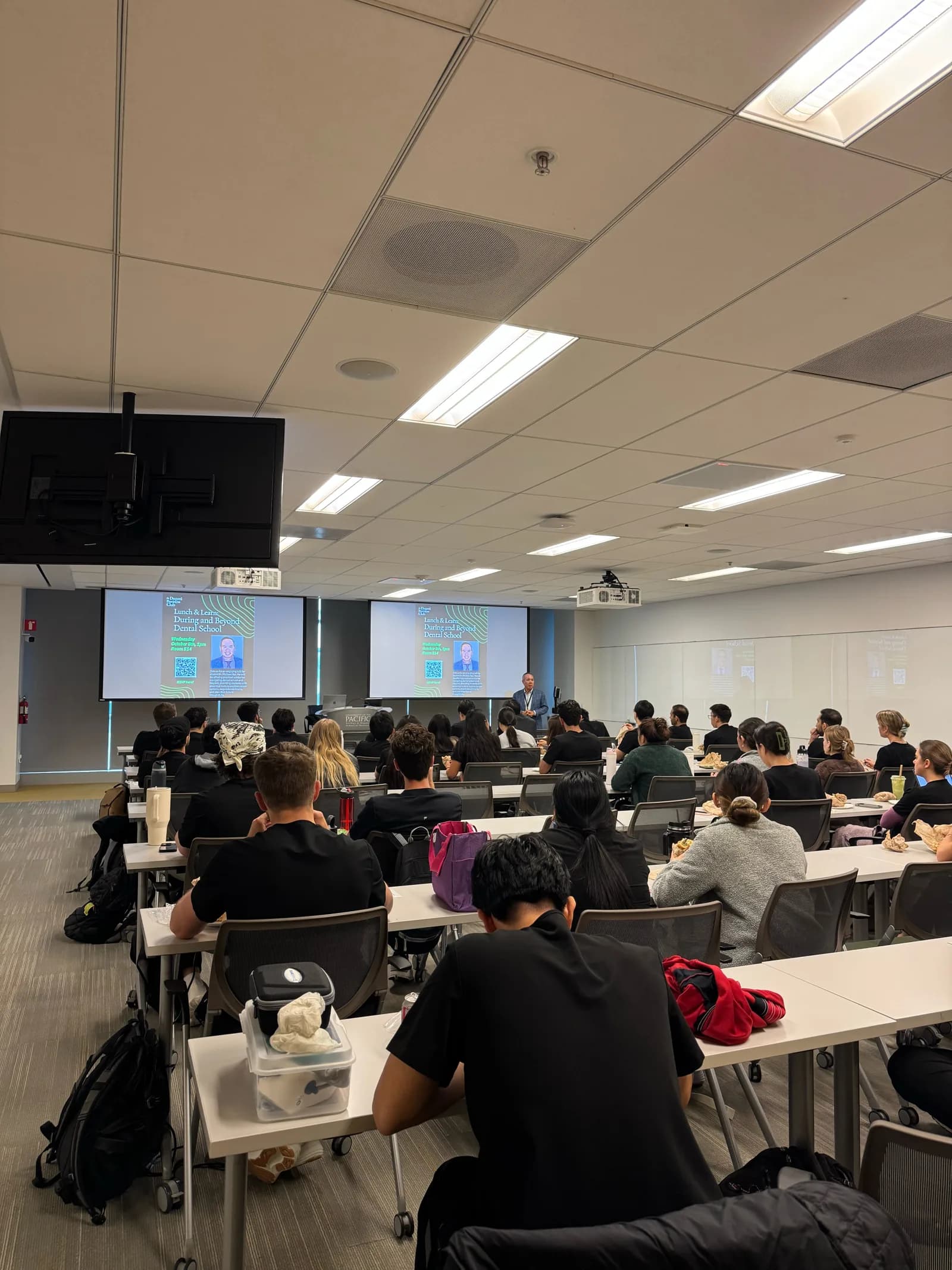 Dr. Michael Njo presenting to Dugoni students during a Lunch & Learn session.