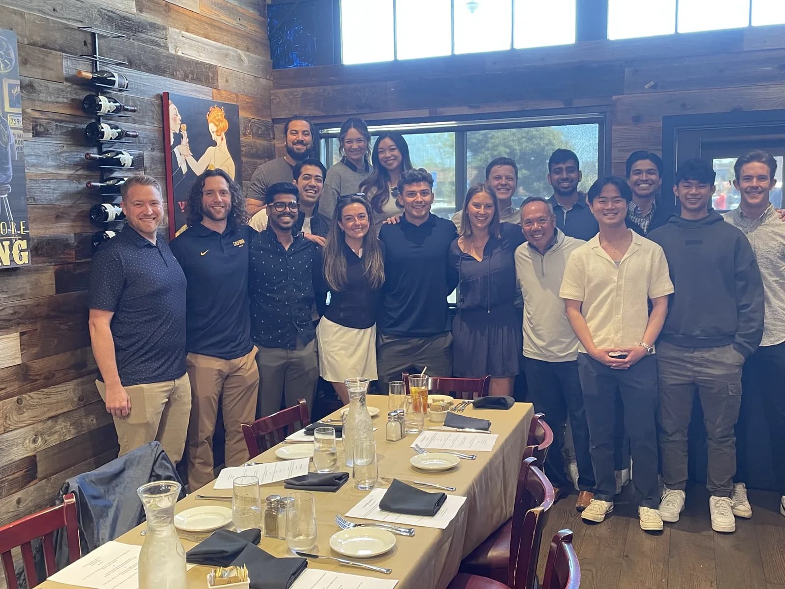 Dr. Michael Njo with a large group of Dugoni Business Club members at a celebration lunch.