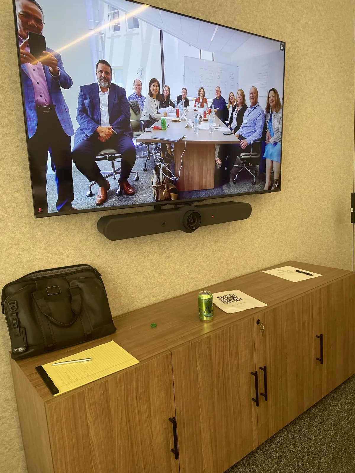 Group photo of dentists attending the July 2026 San Francisco seminar, shown on the conference room display.